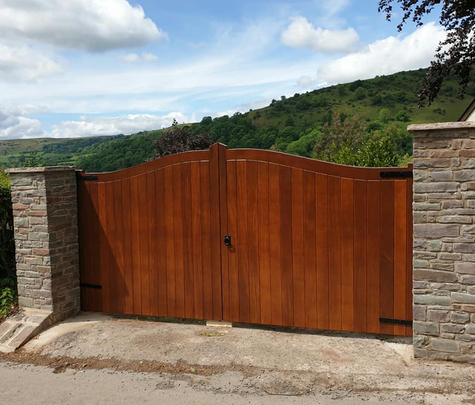 Bespoke driveway gates below the Beacons hillside.